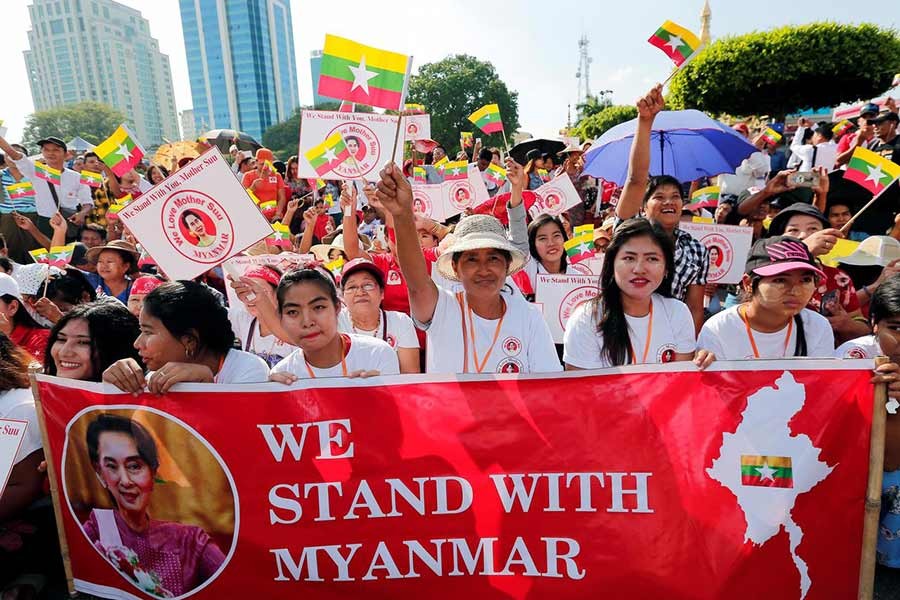 People gathering in a rally in support of Myanmar State Counsellor Aung San Suu Kyi before she heads off to the International Court of Justice (ICJ), in Yangon, Myanmar on Sunday. -Reuters Photo