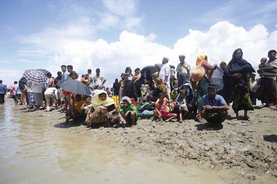 A group of Rohingyas after they fled Myanmar in 2017 arrive at Shahparir Dip in Teknaf, Bangladesh. —Photo credit: IPS