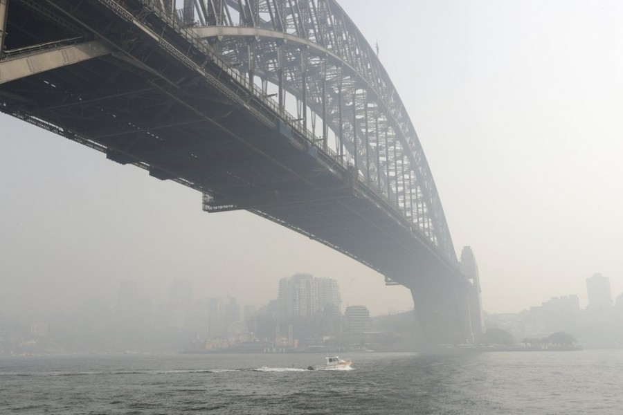 Smoke haze hangs over the Sydney Harbour Bridge in Sydney, on Thursday, Nov 21 - AP Photo/Rick Rycroft