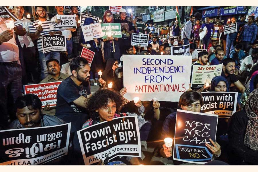 Protesters raise slogans at a midnight candle-light demonstration against the CAA during the New Year celebrations in Chennai, India. —Photo: Courtesy PTI via the Internet