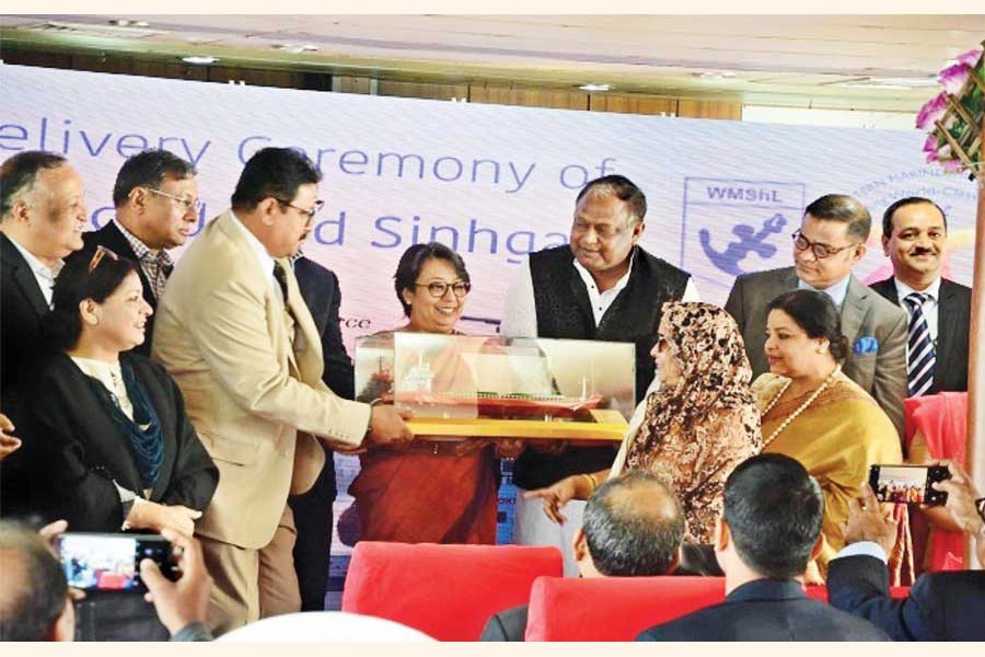 Commerce Minister Tipu Munshi hands over a miniature model of a ship to Indian High Commissioner Riva Ganguly Das at a ceremony marking the delivery of two ships to an Indian company in Chattogram on Friday