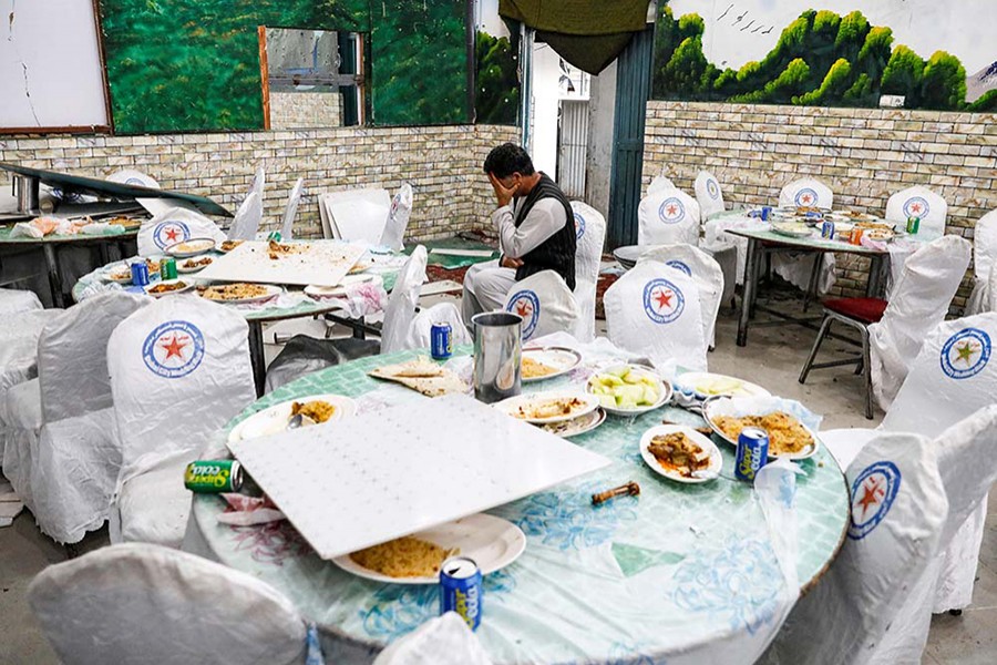 An Afghan man cries as he sits inside a damaged wedding hall after a blast in Kabul, Afghanistan on August 18 last, killing at least 63 people — Reuters/Files