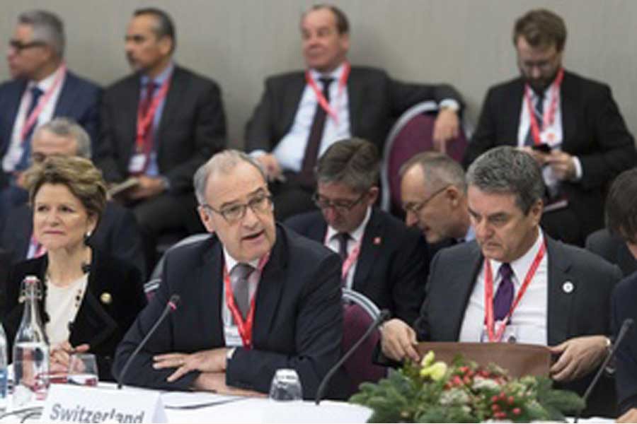 The Swiss economics minister, Guy Parmelin (centre), chaired the ministerial WTO meeting in Davos on January 24, 2020. Seventeen World Trade Organisation (WTO) members, including Switzerland, the European Union and China, have agreed to create a temporary mechanism to settle international trade disputes. The move comes after the United States paralysed the WTO Appellate Body last month, throwing the Geneva-based organisation into crisis. —Credit: swissinfo.ch via the internet