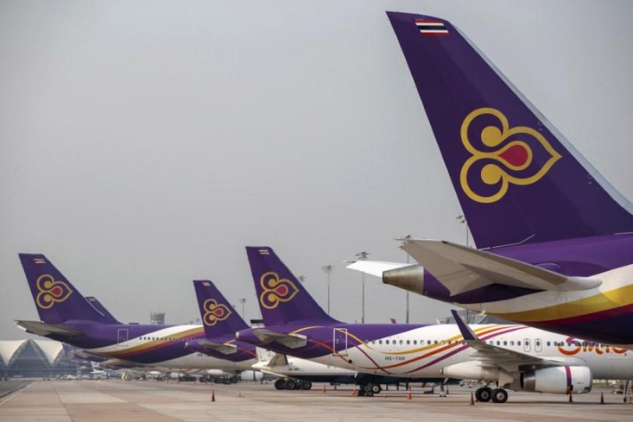FILE PHOTO: Thai Airways aircraft are parked on the tarmac at Bangkok's Suvarnabhumi International Airport March 27, 2015. REUTERS/Athit Perawongmetha