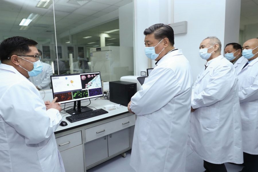 Chinese President Xi Jinping, also general secretary of the Communist Party of China Central Committee and chairman of the Central Military Commission, learns about the progress on the COVID-19 vaccine and anti-body during his visit to the Academy of Military Medical Sciences in Beijing, March 02, 2020. — Photo: Xinhua