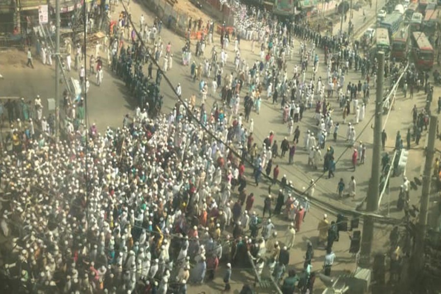Thousands of people take to the streets after the Juma prayers at the national mosque of Baitul Mokarram in Dhaka city on Friday — FE Photo