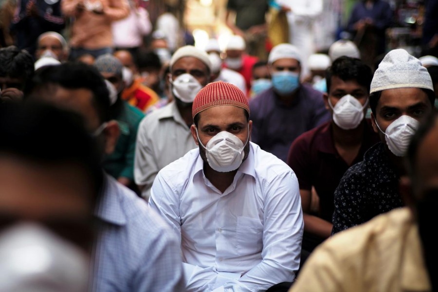 Muslims wear protective face masks following the coronavirus outbreak, as they pray on street during Friday prayers in local souq, in Manama, Bahrain, February 28, 2020 — Reuters