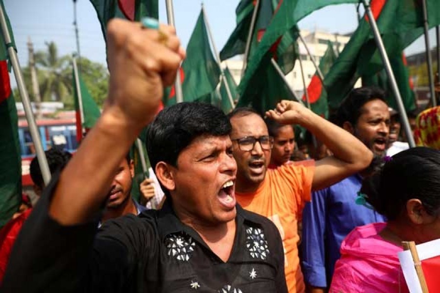 Garments workers and activists shout slogans as they take part in a rally to demand justice for the victims killed in Rana Plaza building collapse in 2013 in Savar, on the outskirt of Dhaka, Bangladesh, April 24, 2019 — Reuters/Files