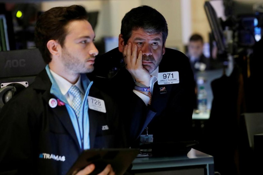 Traders work on the floor of the New York Stock Exchange (NYSE) in New York, US on March 12, 2020. —Photo: Reuters