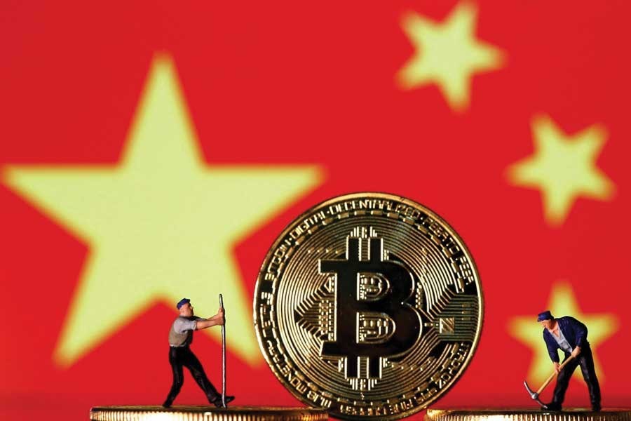 Mu Changchun, the head of the People's Bank of China's digital currency research institute, said China's new digital currency was different to bitcoin. —Photo: Reuters