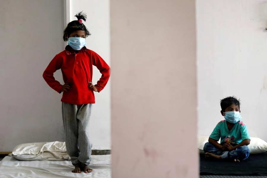 Children of migrant workers staying a sports complex turned into a shelter, during a 21-day nationwide lockdown to slow the spread of the coronavirus disease (COVID-19), in New Delhi, India on Saturday. –Reuters Photo