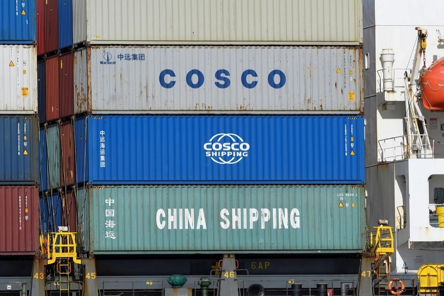 Containers of Chinese companies China Shipping and COSCO (China Ocean Shipping Company) are loaded on a container as it is leaving the port in Hamburg, Germany, March 11, 2020. — Reuters/Files