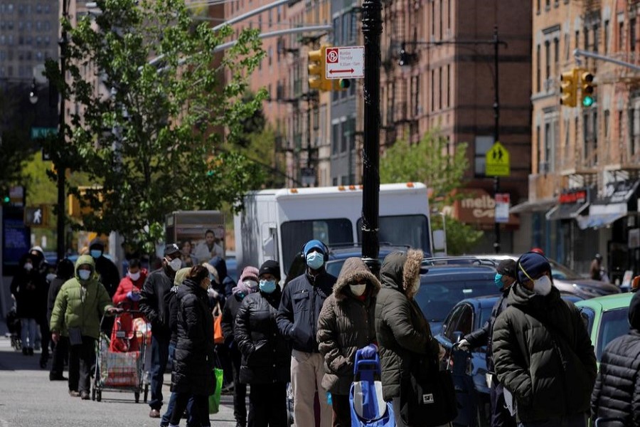 People queue to collect food distribution at Harlem's Community Kitchen and Food Pantry service by the Food Bank for New York City during the outbreak of the coronavirus disease (COVID-19) in the Manhattan borough of New York City, US, May 09, 2020. — Reuters/Files