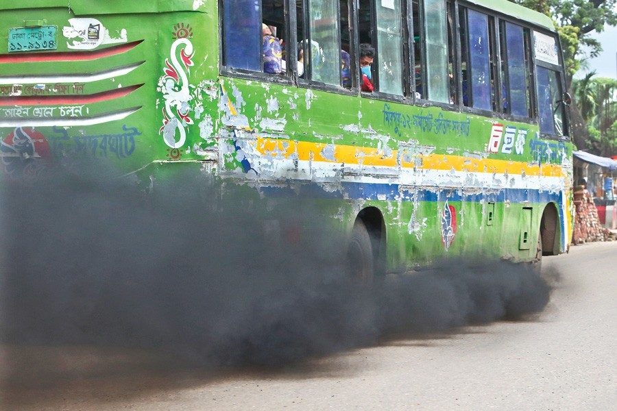 A vehicle spewing black smoke as it plies the Topkhana Road in the city on Friday, the International Environment Day — FE photo by KAZ Sumon