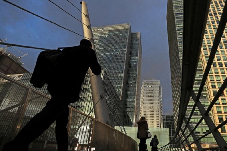 People walk through the Canary Wharf financial district of London, Britain, December 07, 2018 — Reuters/Files