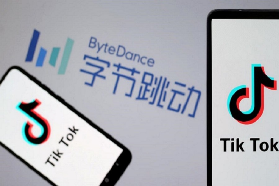 TikTok logos are seen on smartphones in front of a displayed ByteDance logo in this illustration taken November 27, 2019 – Reuters/Files