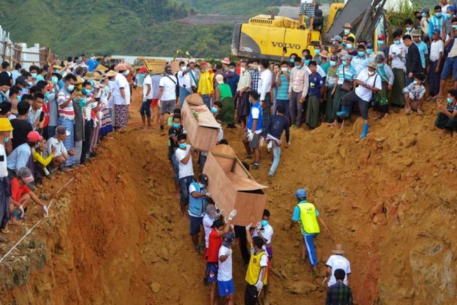 Dozens more jade miners killed in a landslide in northern Myanmar will be buried on Saturday, a local official said, after 77 others were interred in a mass grave on Friday following one of the worst mining accidents in the country’s history, reports Reuters. More than 170 people, many of them migrants seeking their fortune in the jade-rich Hpakant area of Kachin state, died on Thursday after mining waste collapsed into a lake, triggering a surge of mud and water. The miners were collecting stones in Hpakant - the centre of Myanmar’s secretive billion-dollar jade industry - when the wave crashed onto them, entombing them under a layer of mud. Thar Lin Maung, a local official from the information ministry, told Reuters by phone on Saturday 171 bodies had been pulled out but more were continuing to float to the surface. He said the 77 buried on Friday had been identified and 39 would be interred on Saturday. Volunteers carried plywood coffins and placed them into a mass grave carved out by diggers close to the mine site. Many other bodies, battered and stripped of their clothing by the force of the wave that hit them, still have not been identified. Myanmar supplies 90 per cent of the world’s jade, the vast majority of which is exported to neighbouring China, which borders Kachin state. Deadly landslides and other accidents are common in the mines, which draw impoverished workers from across Myanmar. About 100 people were killed in a 2015 collapse that led to calls to regulate the industry. Another 50 died in 2019. But Thursday's landslide was the worst in memory. The country’s leader, Aung San Suu Kyi, on Friday blamed the disaster on joblessness in the country, lamenting in a Facebook Live broadcast that informal workers had to go to the mines for lack of other employment. The government announced the formation of a committee to investigate the disaster. However, activists say little has changed in the industry despite a pledge from Suu Kyi's government to clean it up when she took power in 2016. Rights group Global Witness said in a statement the landslide was a “damning indictment of the government’s failure to curb reckless and irresponsible mining practices.” “Neither a promised new Gemstone law, passed by parliament in 2019, nor a Gemstone policy that has been in production for several years have yet been implemented,” the statement said. The rights group says the trade is worth billions of dollars a year, funds it says fuel armed conflict between government troops and ethnic Kachin rebels fighting for greater autonomy for the region.