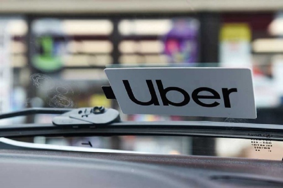 An Uber sticker is seen on driver Margaret Bordelon's car in Lafayette, Louisiana, US — Reuters