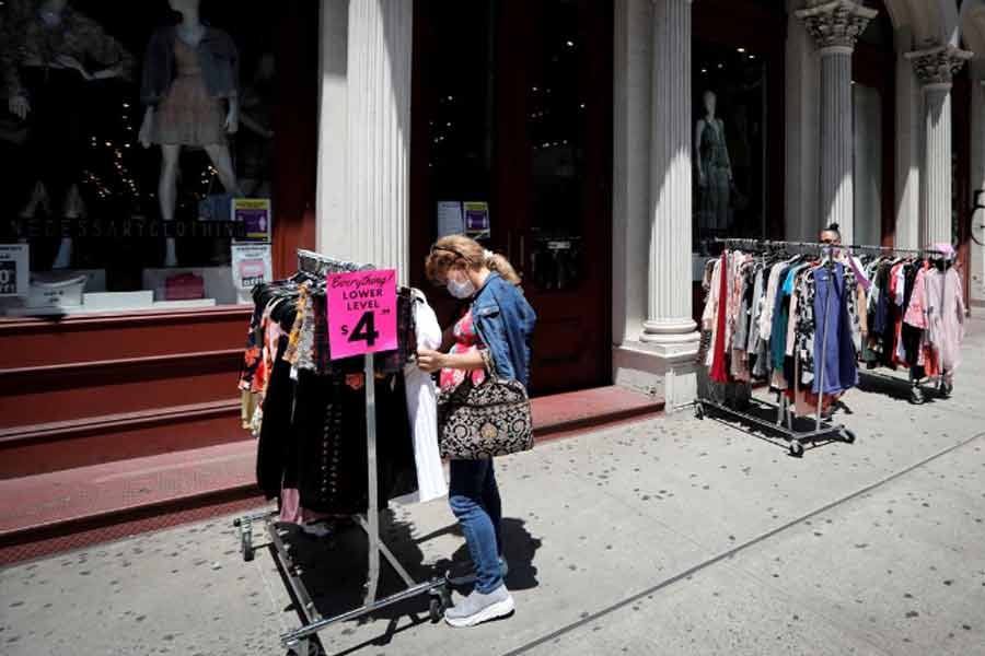 Shoppers browsing racks of clothes at a newly re-opened retail store along Broadway in lower Manhattan on the first day of the phase two re-opening of businesses following the outbreak of the coronavirus disease (COVID-19) in New York last month –Reuters Photo