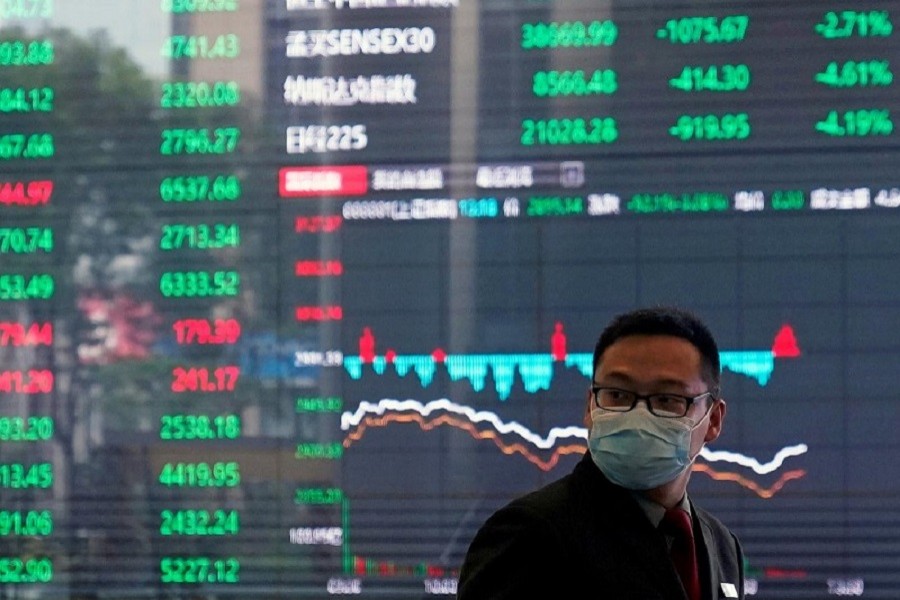 A man wearing a protective mask is seen inside the Shanghai Stock Exchange building, as the country is hit by a new coronavirus outbreak, at the Pudong financial district in Shanghai, China, February 28, 2020 — Reuters/Files