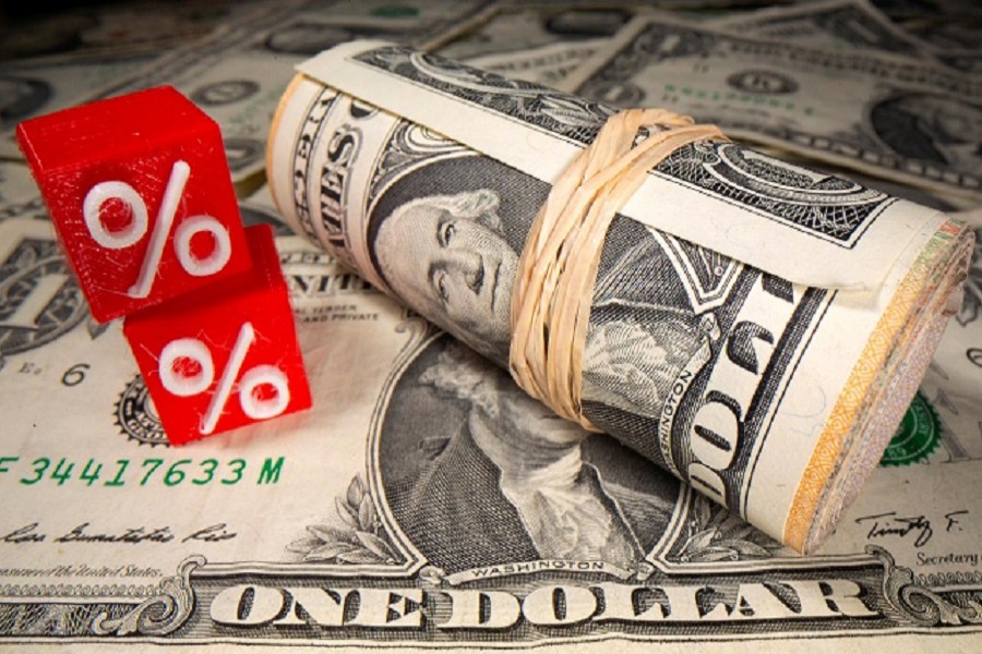 3D printed percentage symbols are seen in front of dollar banknotes in this illustration taken May 25, 2020 — Reuters/Illustration