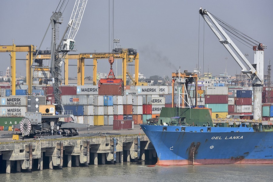 Containers being unloaded from a freighter at Chittagong Port — file photo