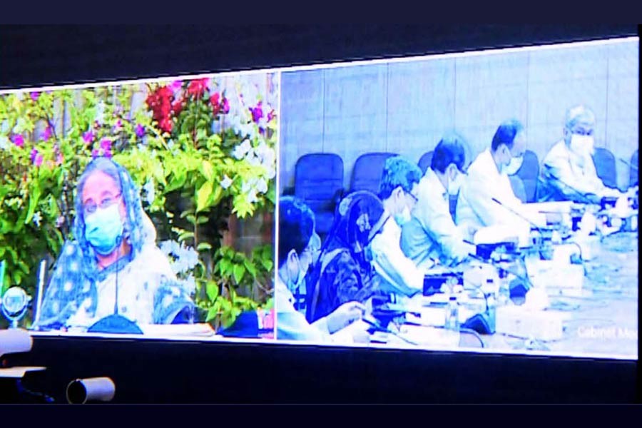 Prime Minister Sheikh Hasina presiding over weekly cabinet meeting through a videoconference from Ganabhaban on Monday, while other cabinet members got connected from the secretariat -PID Photo