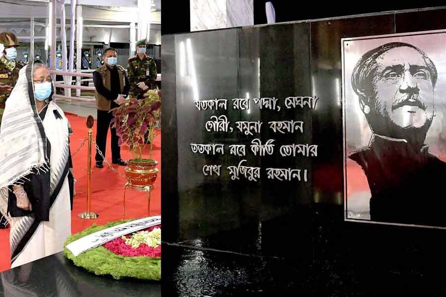 Prime Minister Sheikh Hasina standing in solemn silence after placing a wreath at the portrait of Father of the Nation Bangabandhu Sheikh Mujibur Rahman at the Bangabandhu Memorial Museum at Dhanmondi Road No. 32 in the capital on Staruday marking the National Mourning Day –PID Photo