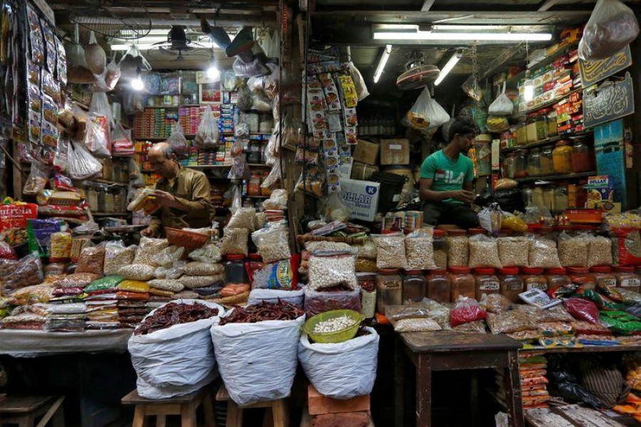 Vendors wait for customers at their respective shops at a retail market in Kolkata, India, December 12, 2018 — Reuters/Files