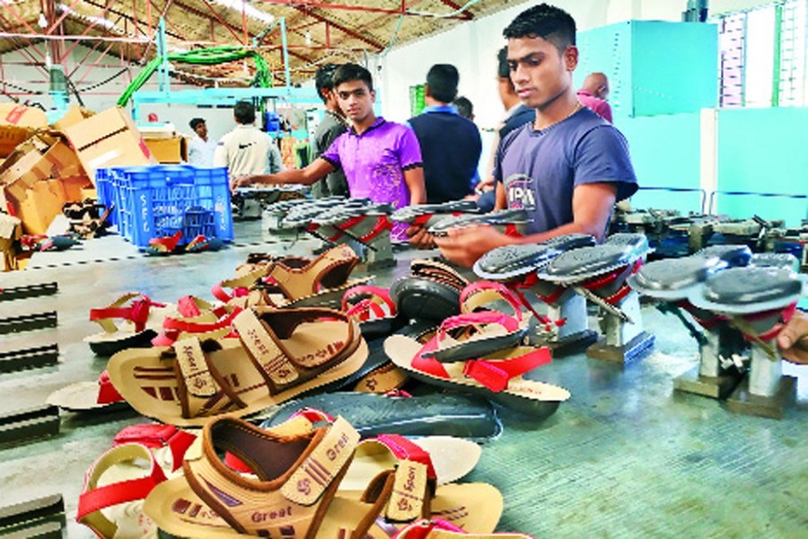 Workers making footwear at a factory in Bhairab — FE file Photo