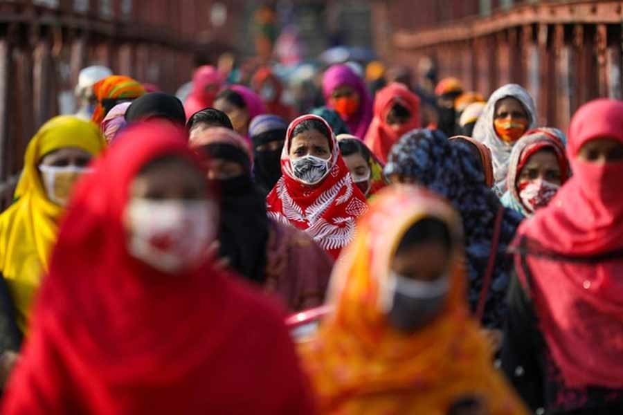 Garment workers returning from a workplace as factories reopened after the government has eased the restrictions amid concerns over the coronavirus disease (Covid-19) outbreak in Dhaka, Bangladesh on May 4, 2020 — Reuters Photo