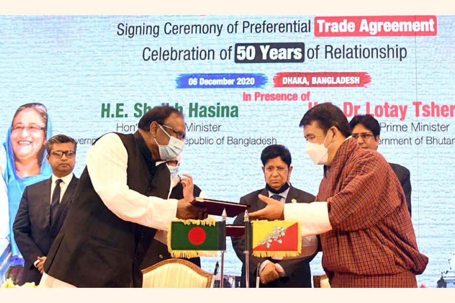 Bangladesh Commerce Minister Tipu Munshi and Bhutanese Economic Affairs Minister Lyonpo Loknath Sharma exchanging PTA document on behalf of their respective countries on December 6, 2020 —- BSS photo