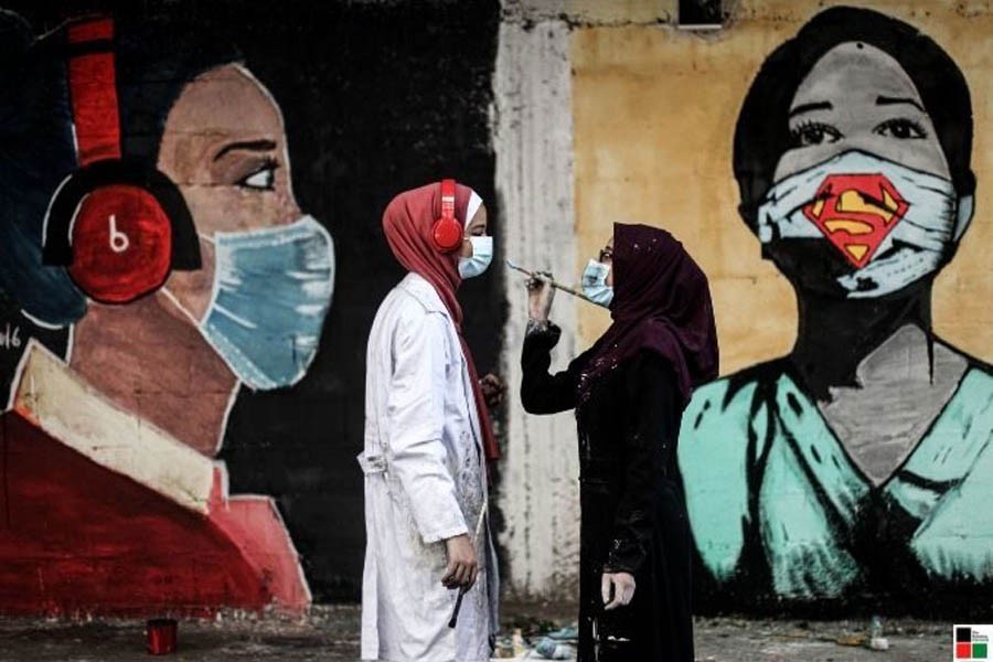 Palestinian artists paint large on Gaza city walls to raise awareness of the importance of wearing the mask as a prevention tool against the Covid-19 —The Palestine Chronicle