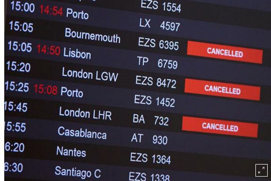 FILE PHOTO: Flights from Britain are announced cancelled at Cointrin airport, the day the Swiss government imposed a 10 days quarantine for travellers who have entered from Britain, during the outbreak of the coronavirus disease (COVID-19) in Geneva, Switzerland, December 21, 2020. REUTERS/Denis Balibouse/File Photo