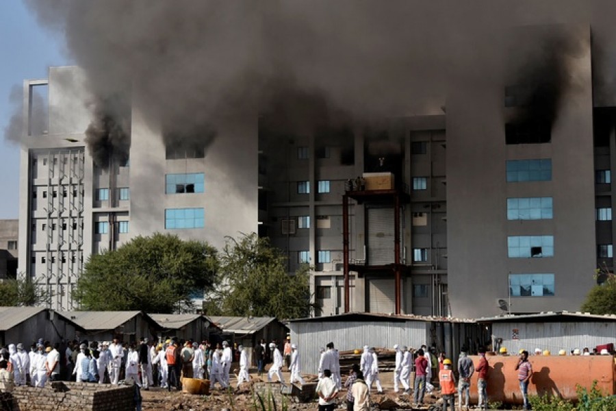 Smoke billows after a fire broke out inside the complex of the Serum Institute of India, in Pune, India, January 21, 2021. REUTERS/Stringer