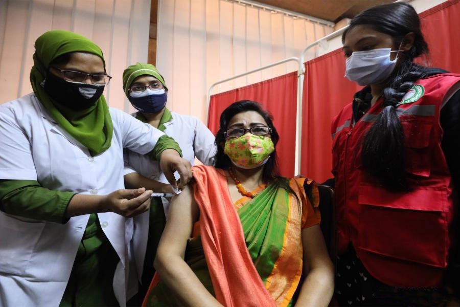 A woman receives the Covid-19 vaccine in Dhaka on February 7. —Xinhua Photo