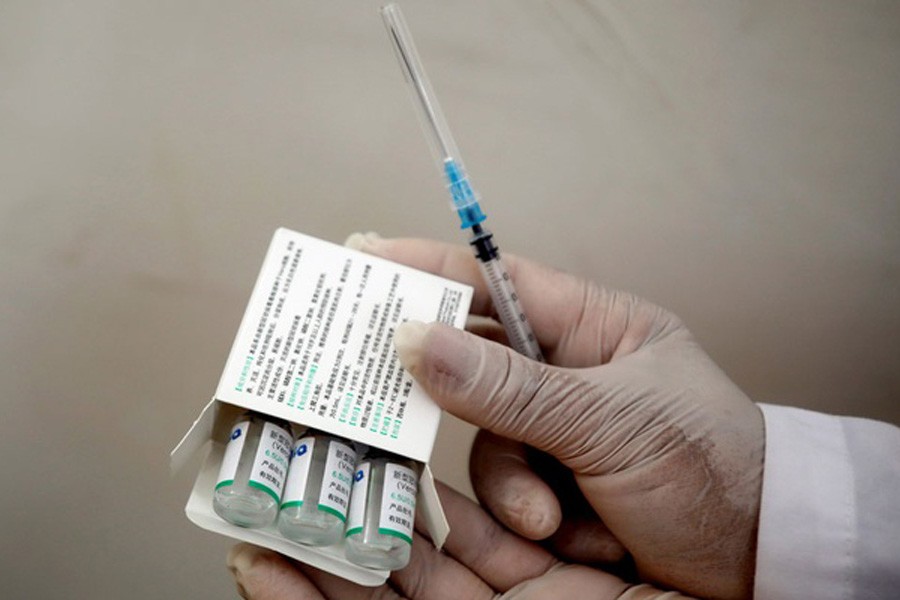 A Palestinian health worker shows vials of Sinopharm vaccine against the coronavirus disease (COVID-19) during a vaccination drive in Tubas, in the Israeli-occupied West Bank April 01, 2021. Reuters