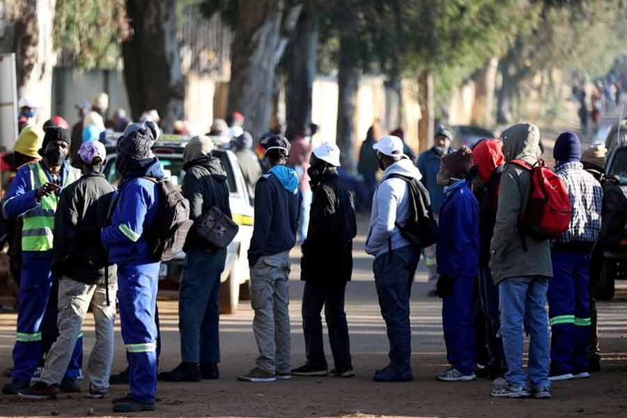 Job seekers standing outside a construction site in South Africa last year -Reuters file photo