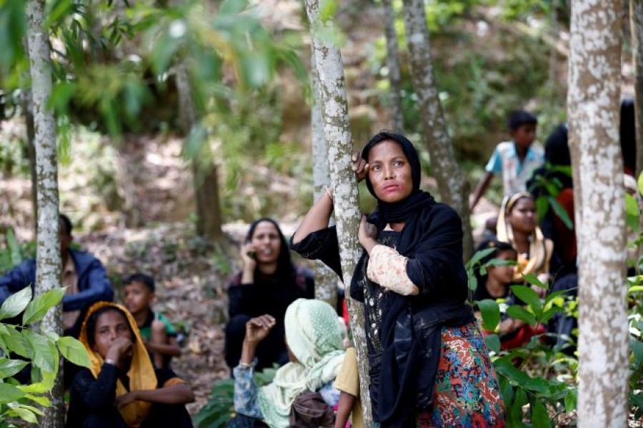 Rohingya woman wait in Cox’s Bazar as they escaped persecution in Myanmar's Rakhine State — Reuters/Files