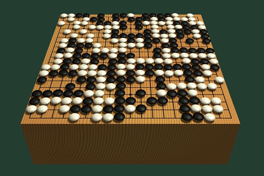 The game, Go, is designed in rich categories with simple rules and regulations with a traditional, carved wooden board, with black and white stones made from slate and clamshell — Internet photo