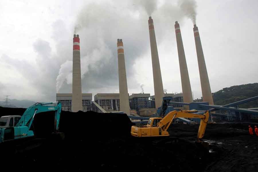 Excavators piling coal in a storage area in an Indonesian Power Plant -Reuters file photo