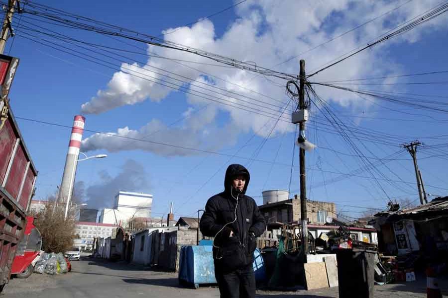 A man walks near a coal-fired power plant in Harbin, Heilongjiang province, China, November 27, 2019. --REUTERS Photo