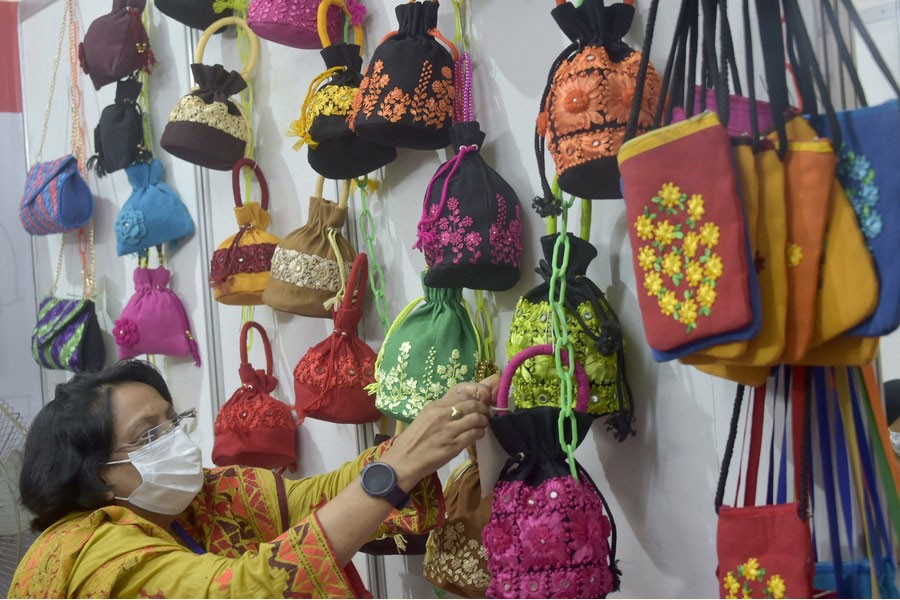A visitor selects products at a stall during Bangladesh's National Small and Medium Enterprise (SME) Fair in Dhaka, capital of Bangladesh, on Dec. 5, 2021. — Xinhua Photo