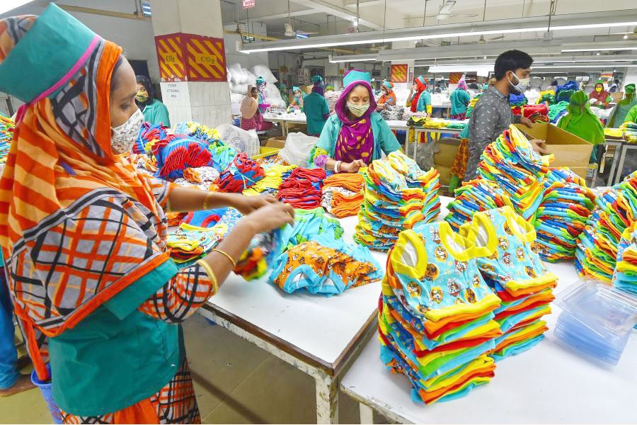 Workers at a ready-made garments factory in Gazipur are passing busy time. —Xinhau Photo