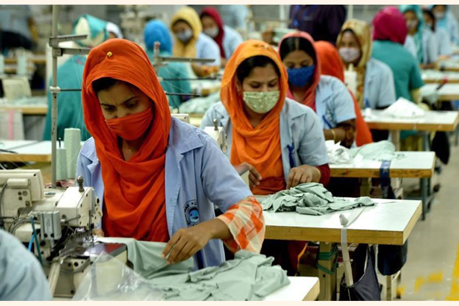 Workers at a RMG factory in Dhaka. —Xinhua Photo