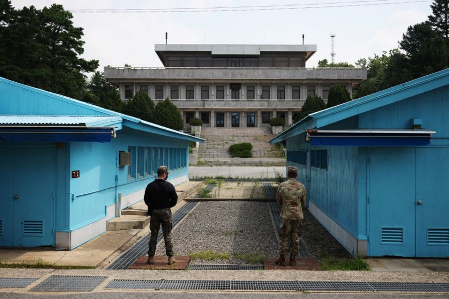 South Korean and US soldiers stand guard in the truce village of Panmunjom inside the demilitarised zone (DMZ) separating the two Koreas, South Korea on July 19, 2022 — Pool via Reuters/Files