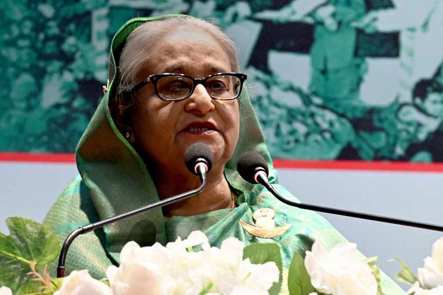Prime Minister and Awami League President Sheikh Hasina addressing a discussion at the Krishibid Institute Bangladesh (KIB) auditorium at Farmgate in the capital city, organised by an Awami League (AL) marking the 52nd Victory Day –PID Photo